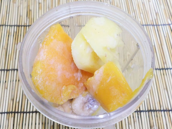 put tropical trio smoothie ingredients in a blender