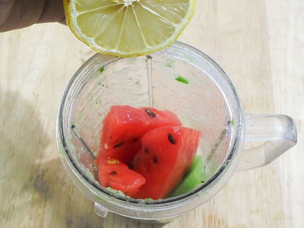 Mix ingredients of watermelon kiwi smoothie for glass skin in a blender