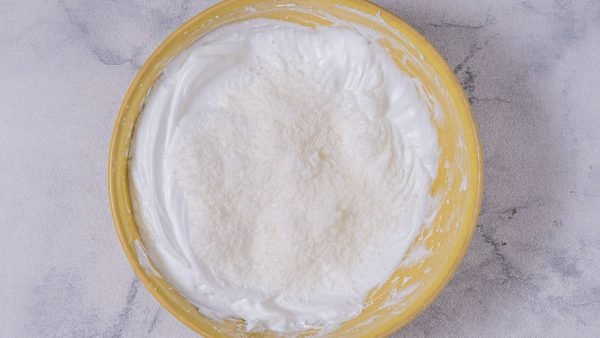3. Gently fold in shredded coconut and vanilla extract.